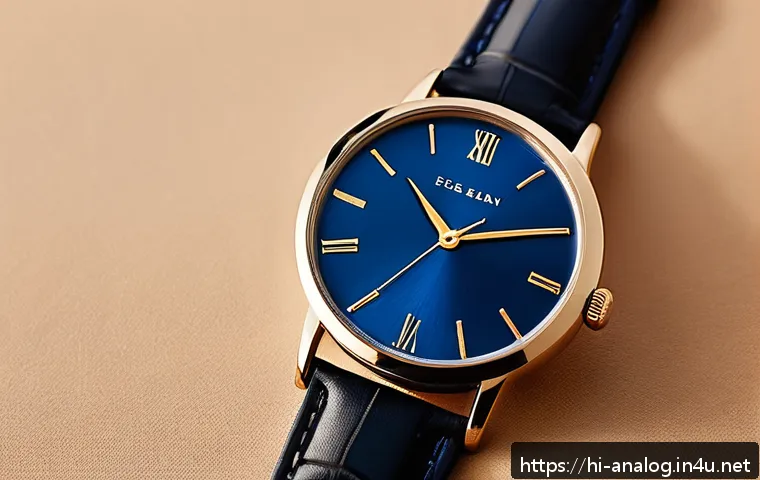 아날로그 시계 디자인 - A classic 1950s-inspired analog wristwatch featuring a round metallic blue dial with subtle texture ...