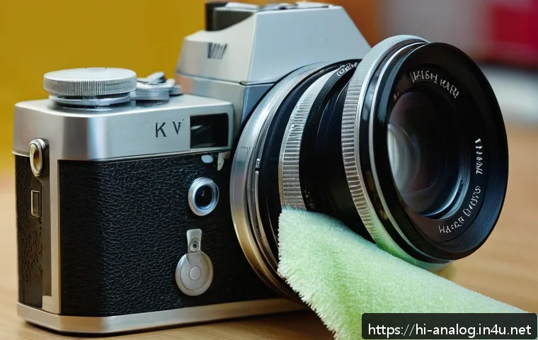 아날로그 카메라 복원 - A close-up image of an old analog camera being carefully cleaned: a soft brush gently dusting the ca...